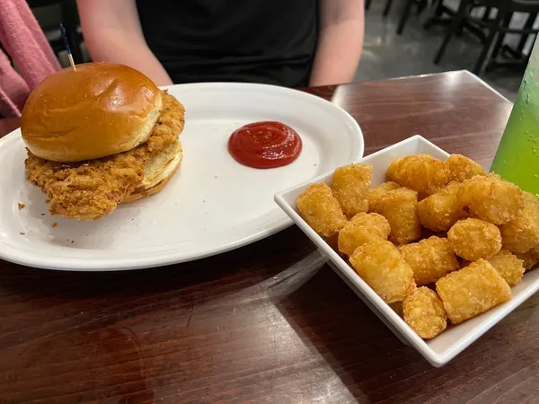 Breaded tenderloin sandwich with tater tots